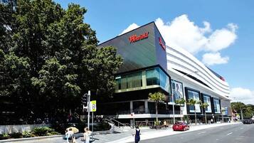 A Westfield shopping mall with a modern architectural design, featuring large glass windows and a prominent signage.