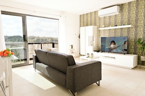 Family Apartment, Multiple Bedrooms (A Sunny Seaview In Central Sliema) | Living area | TV