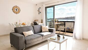 Family Apartment, Multiple Bedrooms (A Sunny Seaview In Central Sliema) | Living area | TV