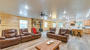 A spacious living room with leather sofas, a wooden coffee table, and a ceiling fan. - Covered Patio, Creek & Mtn Views: Afton Nature Hub (Afton)