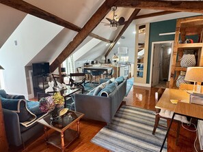 A loft-style living space with a dining area, kitchen, and open-plan layout. - Feel simply blue and amazed (Lisboa)