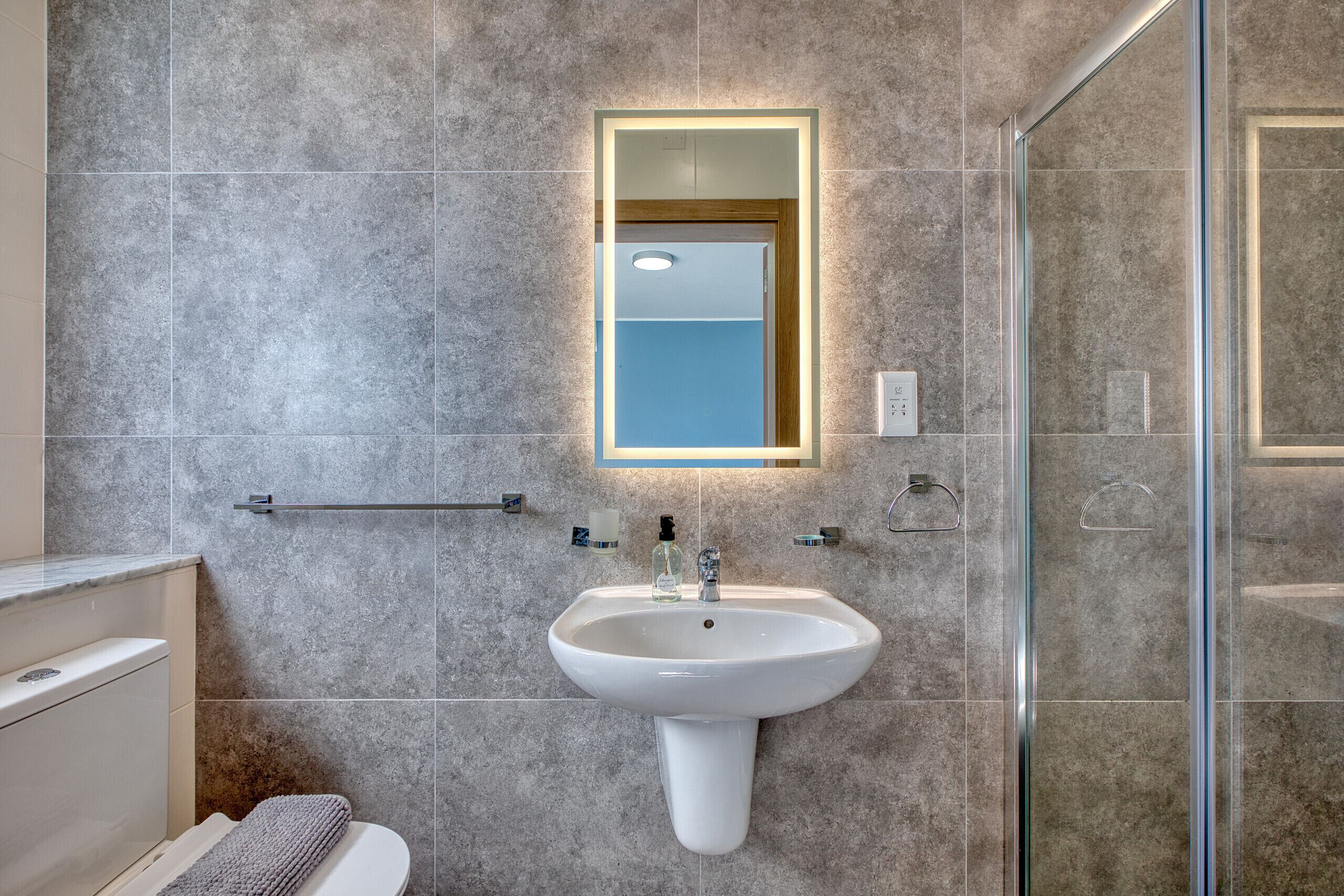 Shower, hair dryer, towels, soap