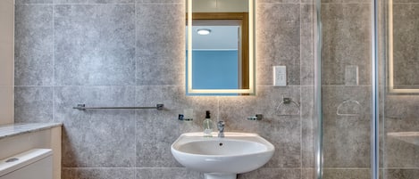 Shower, hair dryer, towels, soap