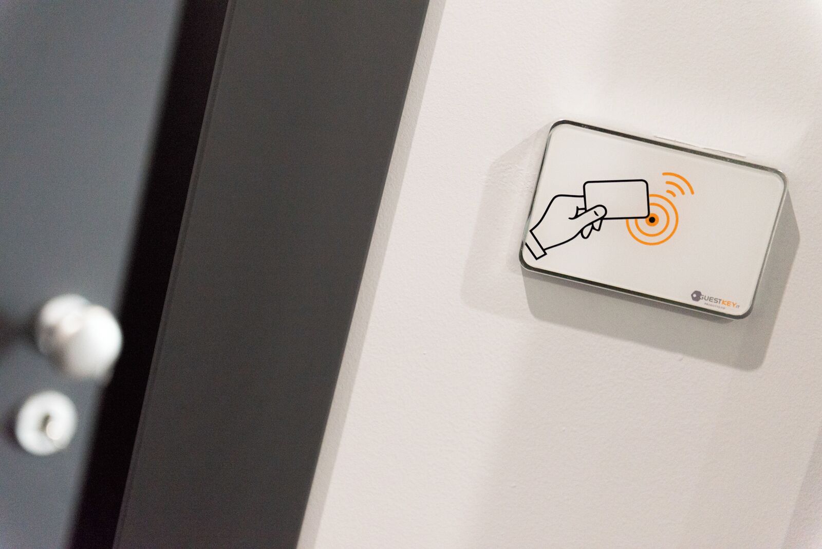 A digital lock with a hand icon and a Wi-Fi signal, indicating a keyless entry system.