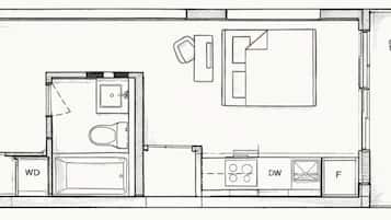 Plano de planta con balcón, zona de cocina y aseo separado.