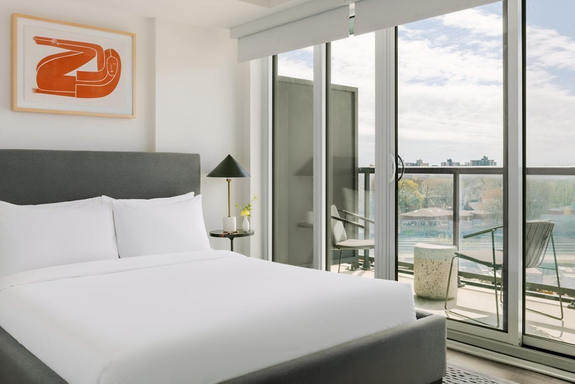 Premium bedding, memory-foam beds, laptop workspace, blackout curtains