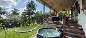 Architect-designed villa with colonial-style veranda. Spa, volcano & sea views .