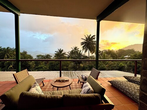 Architect-designed villa with colonial-style veranda. Spa, volcano & sea views .