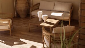 A cozy seating area with a sofa, two chairs, and a coffee table.