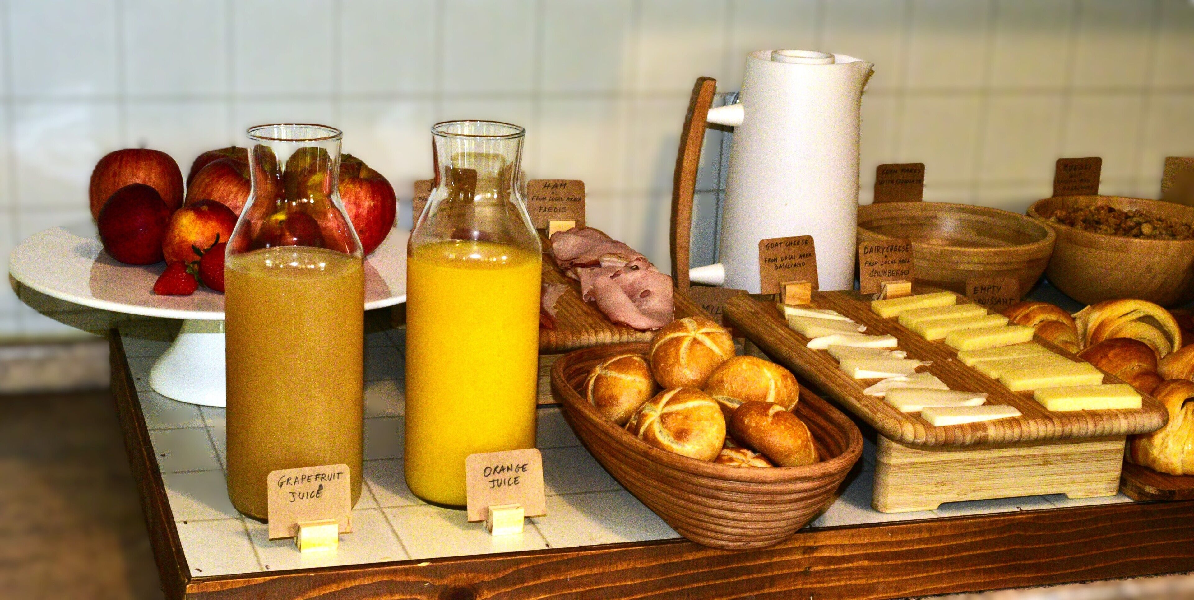 A breakfast buffet with various food items and beverages.