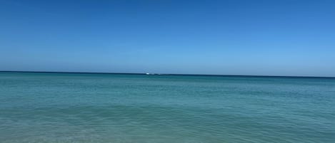 On the beach, sun loungers, beach towels