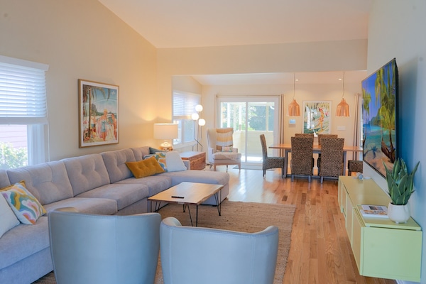 Mid-century inspired living space with clean lines and relaxes coastal styling