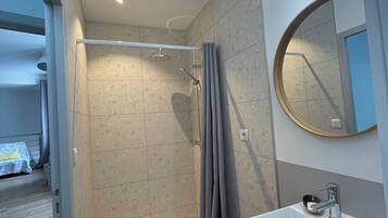 Shower, hair dryer, towels, toilet paper