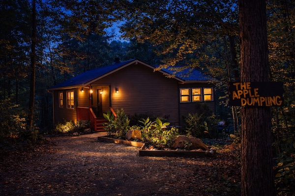 Twilight magic at The Apple Dumpling—where glowing lights, quiet woods, and cozy nights await.