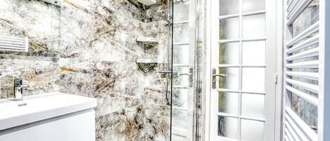 Shower, hair dryer, towels, toilet paper