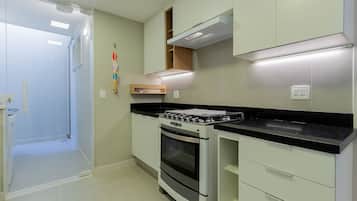 Coffee/tea maker, fridge, oven, cookware/dishes/utensils