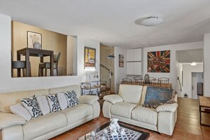 A living room with a sofa, armchairs, a coffee table, and a dining area with chairs and a table. - Villa "Les Hauts De Taradeau": Mountain View with Stunning Private Pool (Taradeau)
