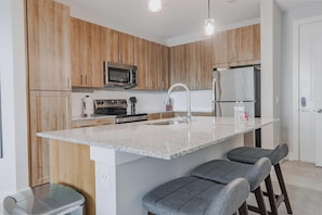 Fridge, dining tables - Landing | Stylish 2BD, Gym, Pool (Palm Bay)