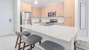 Fridge, dining table - Landing | Amazing 2BD, Pool, Gym (Palm Bay)