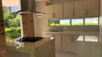 Fridge, microwave, stovetop, coffee/tea maker