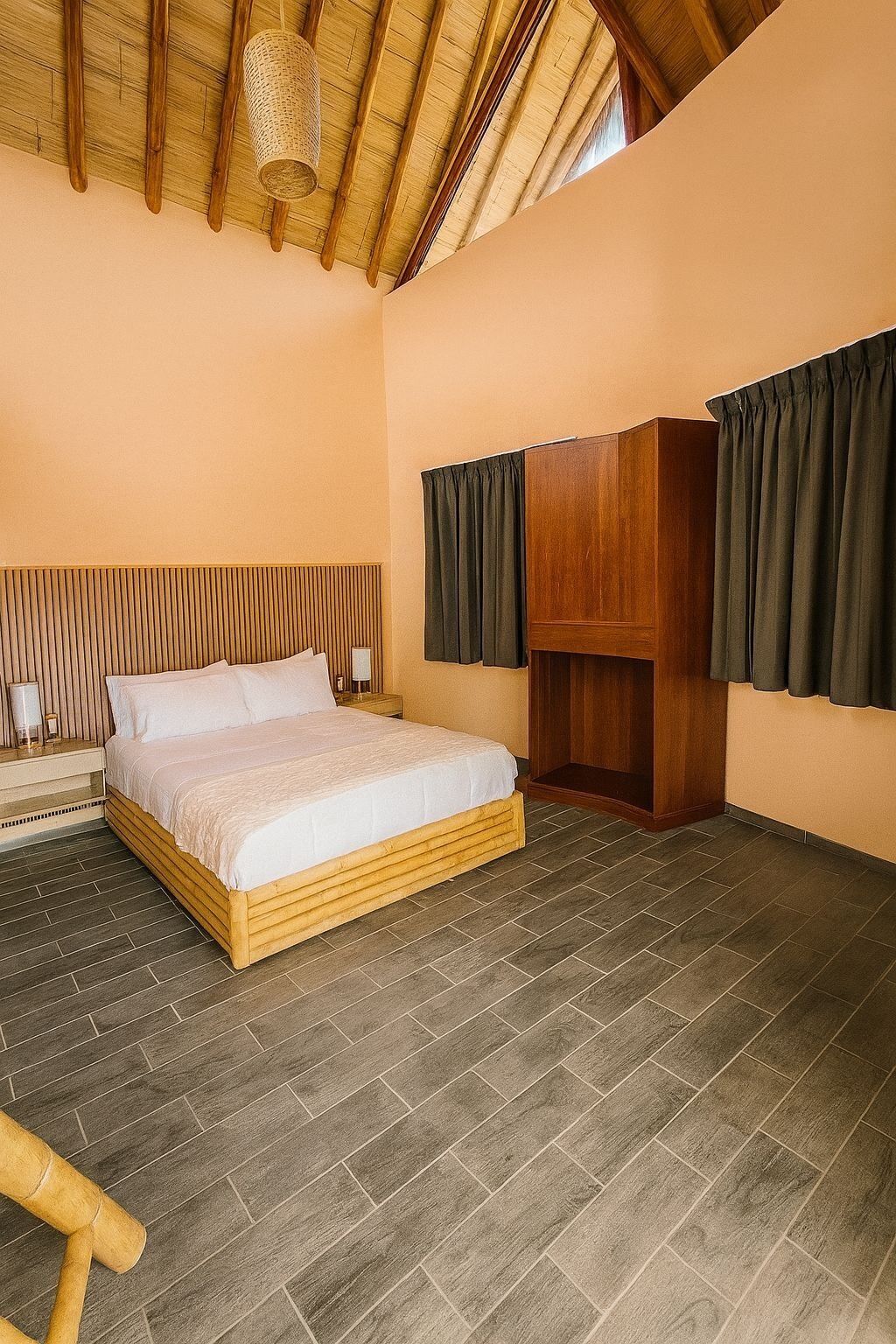 A bedroom with a wooden bed, a wooden wardrobe, a nightstand, and a woven basket hanging from the ceiling.