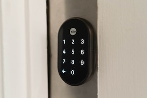 A Yale keypad lock on a door.