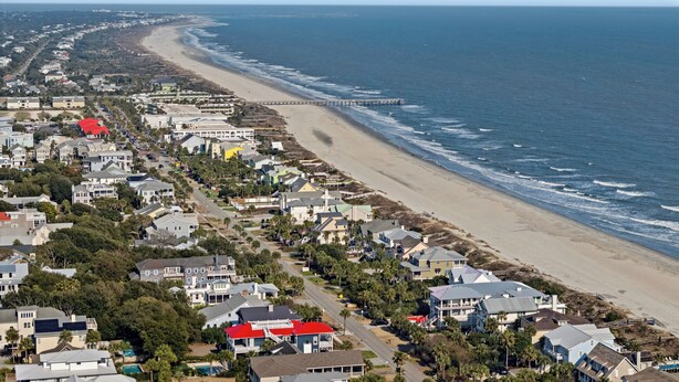 A coastal residential area with houses, a beach, and a pier. - Camp Carolina 3BR 2BA home with private pool close to beach! (Isle Of Palms)