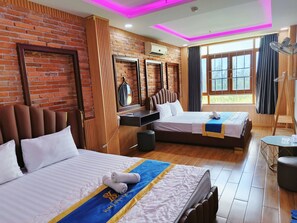 A hotel room with two beds, a wooden accent wall, a large window with curtains, and a ceiling with pink lighting. - Kim Linh Hotel  (Ho Chi Minh City)