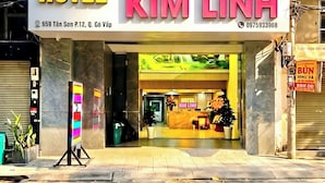 A hotel named 'Kim Linh' with a reception desk and a colorful display board outside. - Kim Linh Hotel  (Ho Chi Minh City)