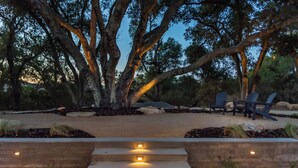 A patio area with outdoor seating, a concrete staircase, and trees. - Estate @ Oak & Vine Vineyard Estate | Sleeps 33 (Templeton)