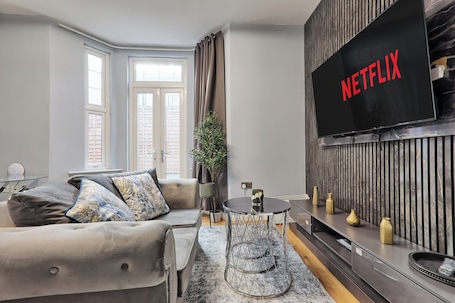 TV, fireplace. Modern 1 Bedroom Apartment Near West Cliff Beach | Sleeps 2