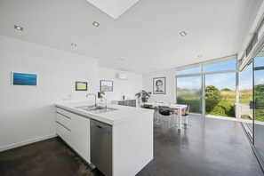 Fridge, dishwasher, toaster, cookware/dishes/utensils - Peka Peka Beach House - Waikanae Holiday Home (Waikanae)