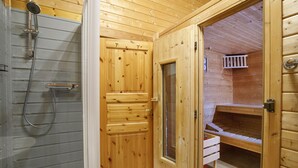 A wooden sauna room with a glass door, a shower area, and a bench. - The Wooden House, Breanish Uig, Isle of Lewis (Uig)