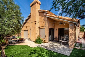 A house with a covered patio, a visible door, and a number '2873' on a column. - Cool & Comfy Tucson Summer Retreat w/ Yard (Tucson)