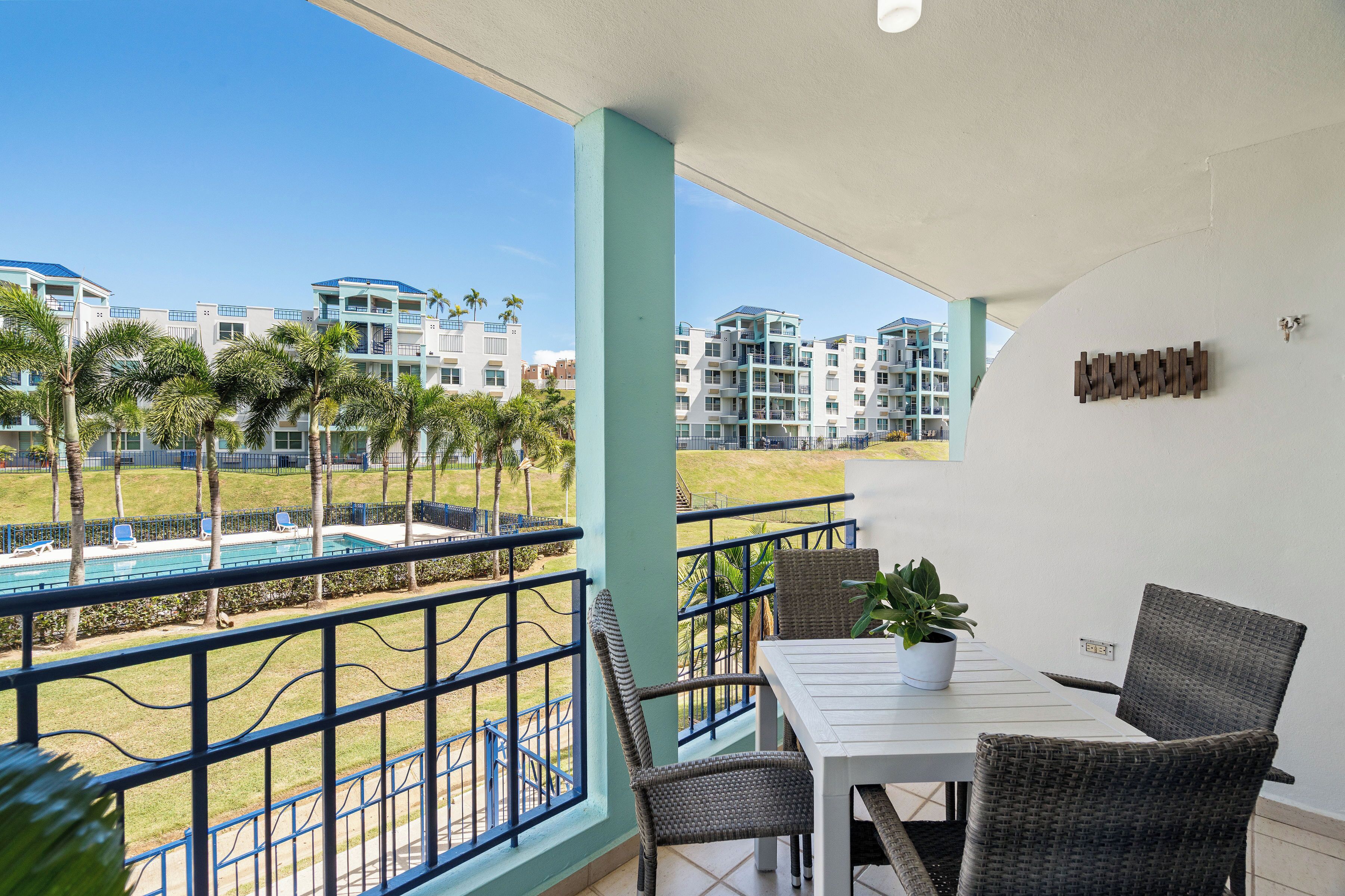 Luxury Apartment, Balcony, Pool View | Outdoor dining