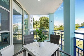 Luxury Apartment, Balcony, Pool View | Outdoor dining - Costa Brava Condo by Otium (Ceiba)