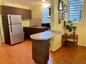 Fridge, microwave, oven, stovetop - Charming Vintage Apartment Steps from the Beach (San Juan)