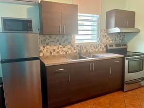 Fridge, microwave, oven, stovetop - Ocean-Inspired Apartment | Near Ocean Park Beach (San Juan)