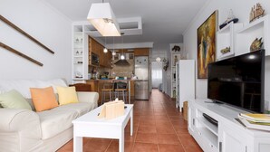 A modern apartment with a living room, kitchen, and dining area. - Home2Book Elegant City Escape with Terrace (Puerto Lajas)