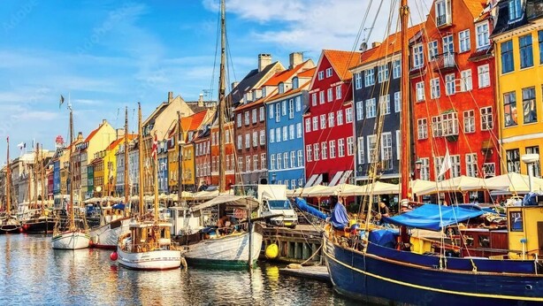 A harbor with colorful buildings and boats docked.