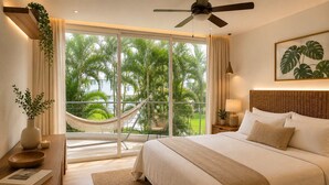 A bedroom with a bed, a nightstand, a lamp, a window with a view of palm trees, and a ceiling fan. - Beach, Pool & Relaxation in Nuevo Vallarta (Nuevo Vallarta)