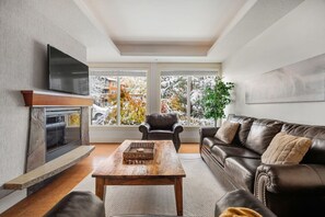 TV, fireplace - Rocky Mountain Retreat | Sleeps 6 • King + Queen (Canmore)