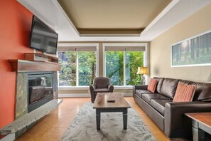 TV, fireplace - Modern Condo Retreat 2BR+Sofa Bed | Patio & Trails (Canmore)