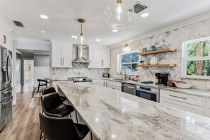 Fridge, microwave, oven, stovetop - Coastal Canopy | Pool, Hot Tub, Pergola & Huge Fenced Yard – 4BR Near Beach ( 5 Min Drive) (Seminole)
