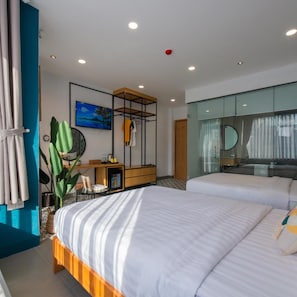 A modern hotel room with two beds, a desk, a mirror, and a large window. - Shoho Hotel Nha Trang (Nha Trang)