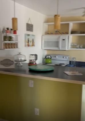 Fridge, microwave, oven, stovetop - Penguins on the Beach 2BR Steps to Beach & Downtown, pool,  Unit 7 (Cocoa Beach)