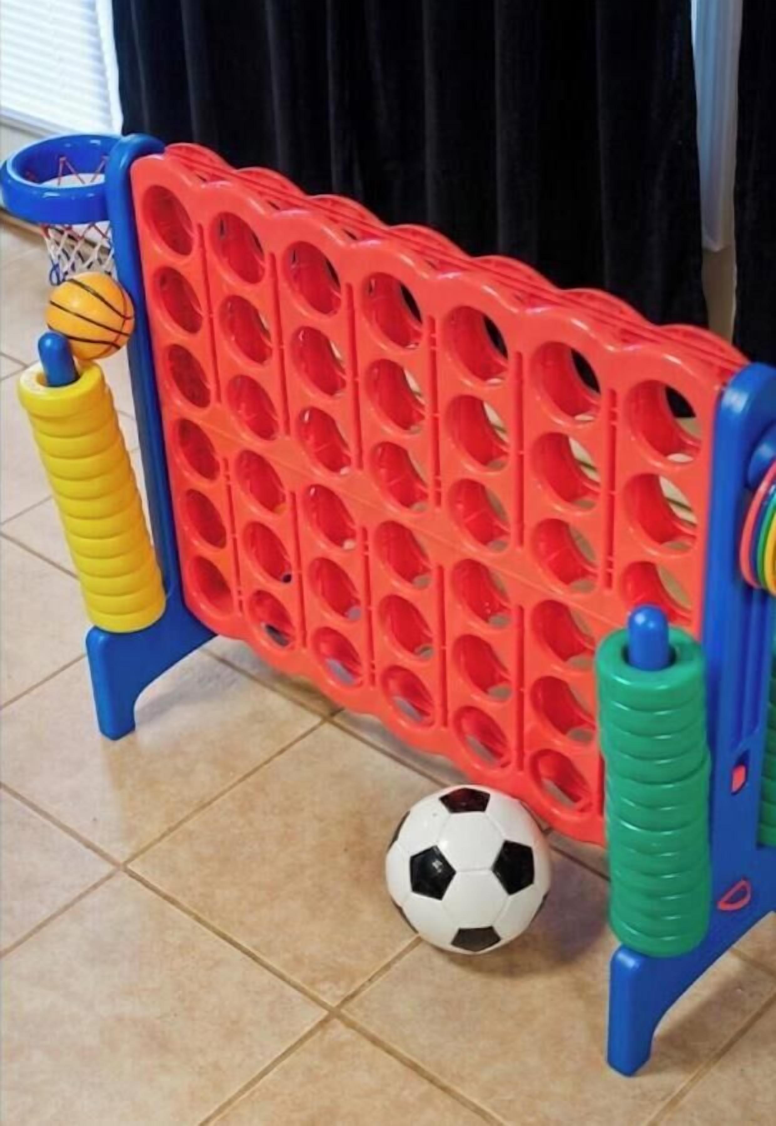 A red and blue playpen with a soccer ball and a basketball.