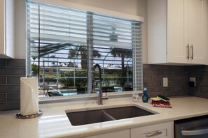 Fridge, microwave, oven, stovetop - Spacious, renovated vacation home with heated pool and private boat dock (Cape Coral)