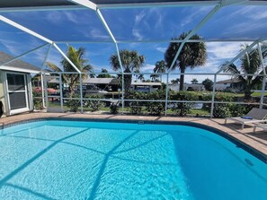 Outdoor pool, a heated pool - Spacious, renovated vacation home with heated pool and private boat dock (Cape Coral)