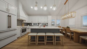 Ett modernt kök med vita skåp, en köksö med barstolar, en matplats med trästolar och hängande lampor.